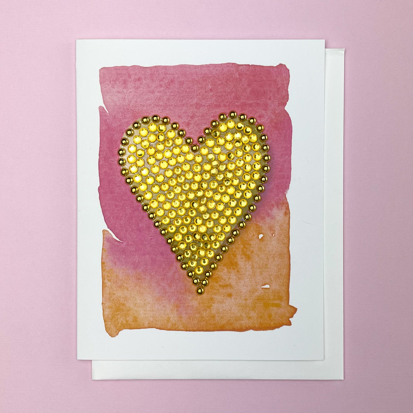 Gold Heart on Pink and Orange Watercolour Background Greeting Card