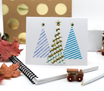 Merry Christmas trees greeting card with colourful hand-applied sparkling details