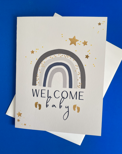 Welcome Baby rainbow grey greeting card with hand-applied sparkling details